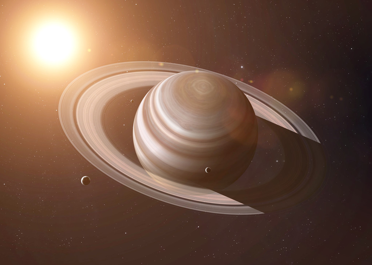 土星环在阳光的照耀下。这张照片的元素由美国宇航局提供。Saturns rings are shining with sunlight. Elements of this image furnished by NASA.
