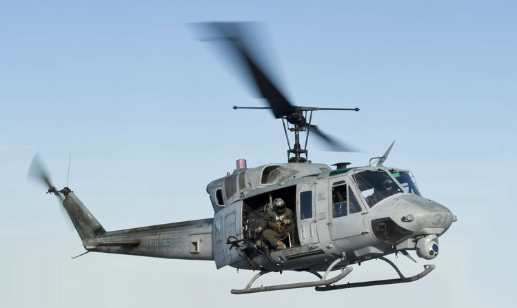 120131-N-XK513-120_Sailor_directs_a_UH-1N_Huey_helicopter_from_(VMM)_261_(cropped).jpeg